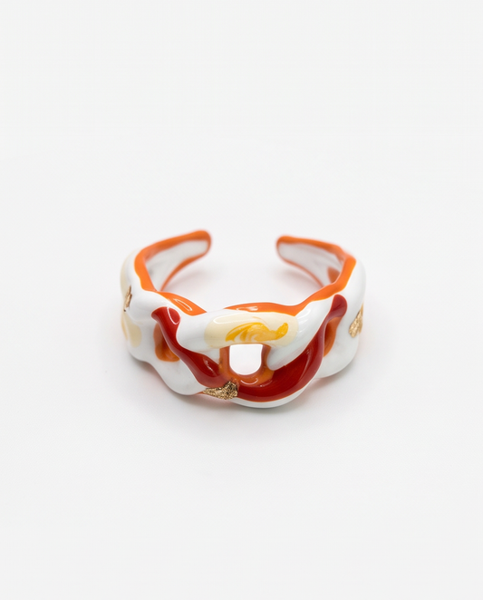 Red and orange ceramic ring with gold flakes