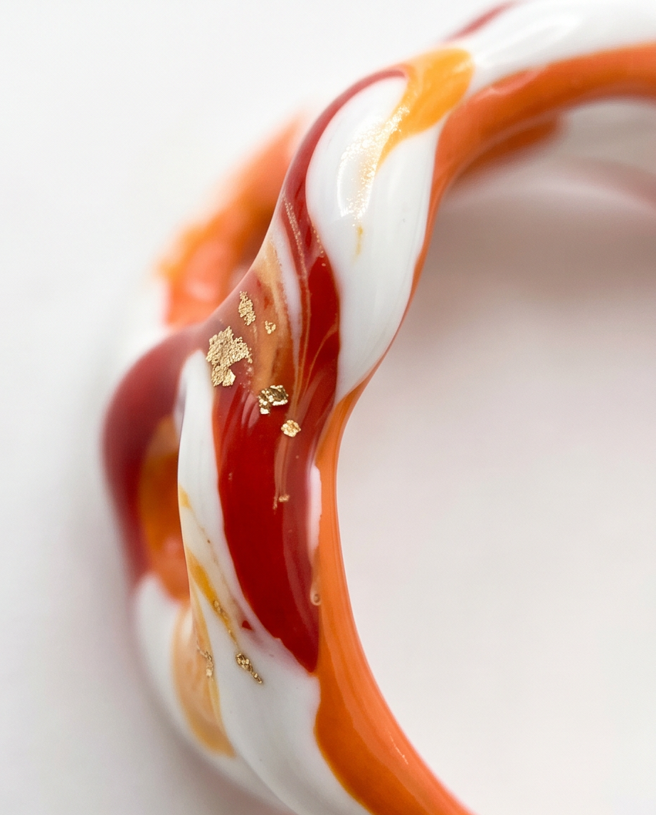 Red and orange ceramic ring with gold flakes