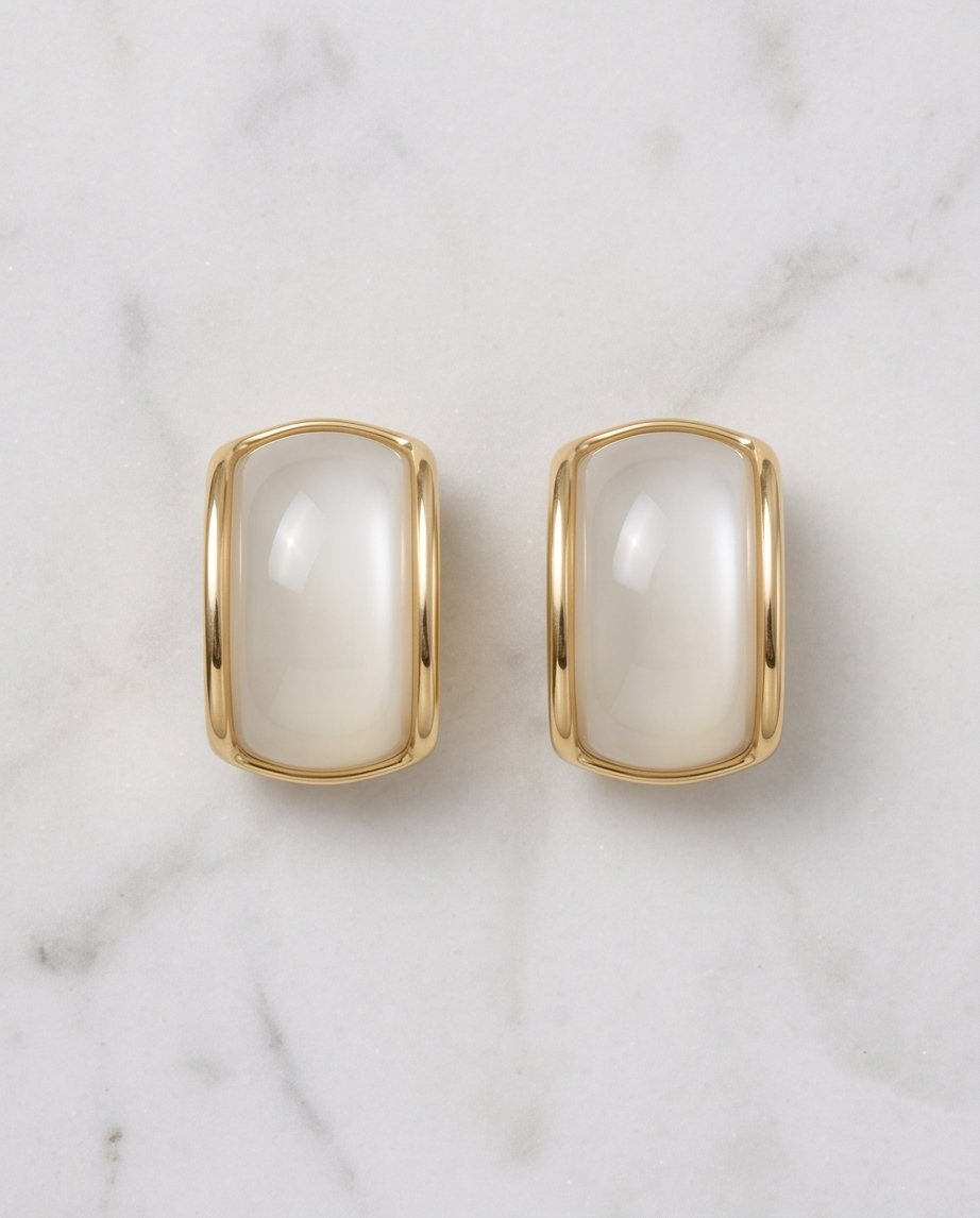 Curved yellow trimmed pearl earrings